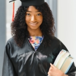 beautiful african female student with graduation certificate