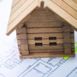 Building house on blueprints with plan - construction project