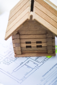 Building house on blueprints with plan - construction project