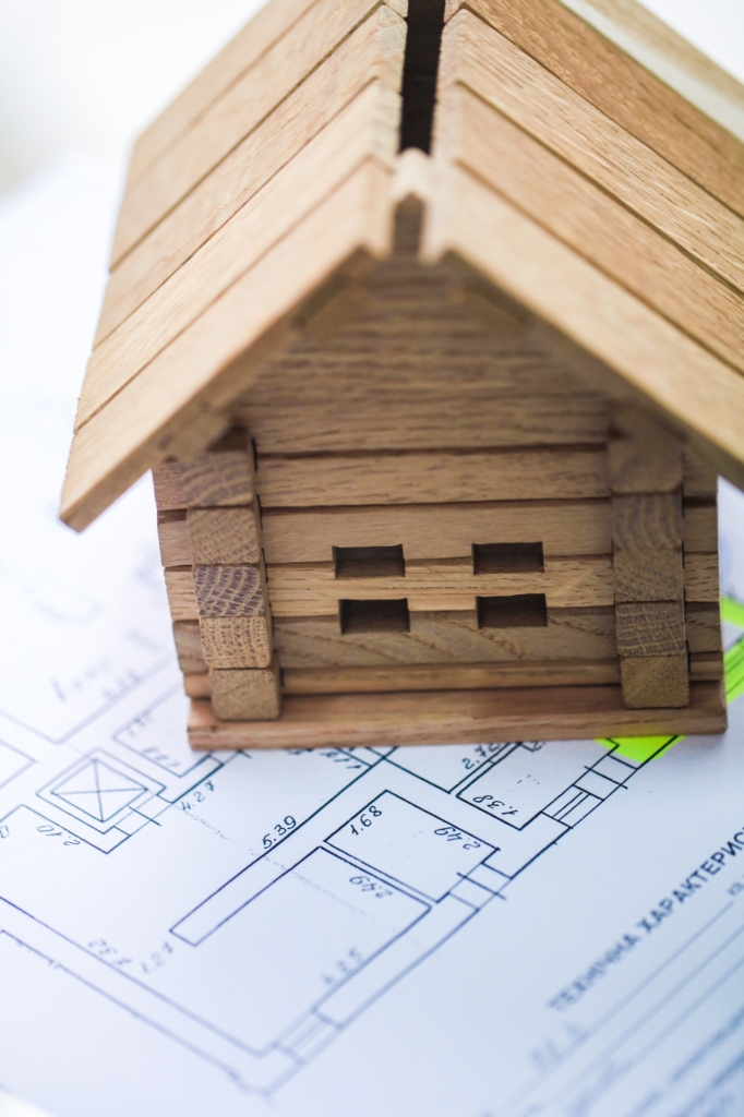 Building house on blueprints with plan - construction project